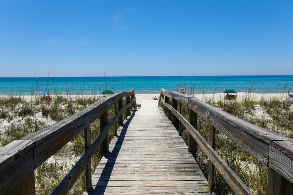 A path to a beach, one of the best things to do in Destin, Florida, in the summer.